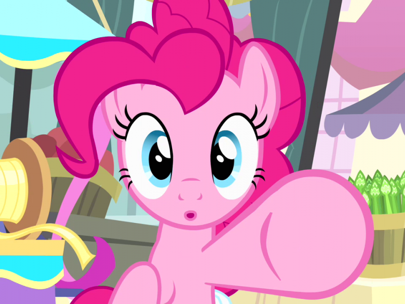 Pinkie Pie, a bright pink pony from the My Little Pony television series, looking at and motioning to the reader.