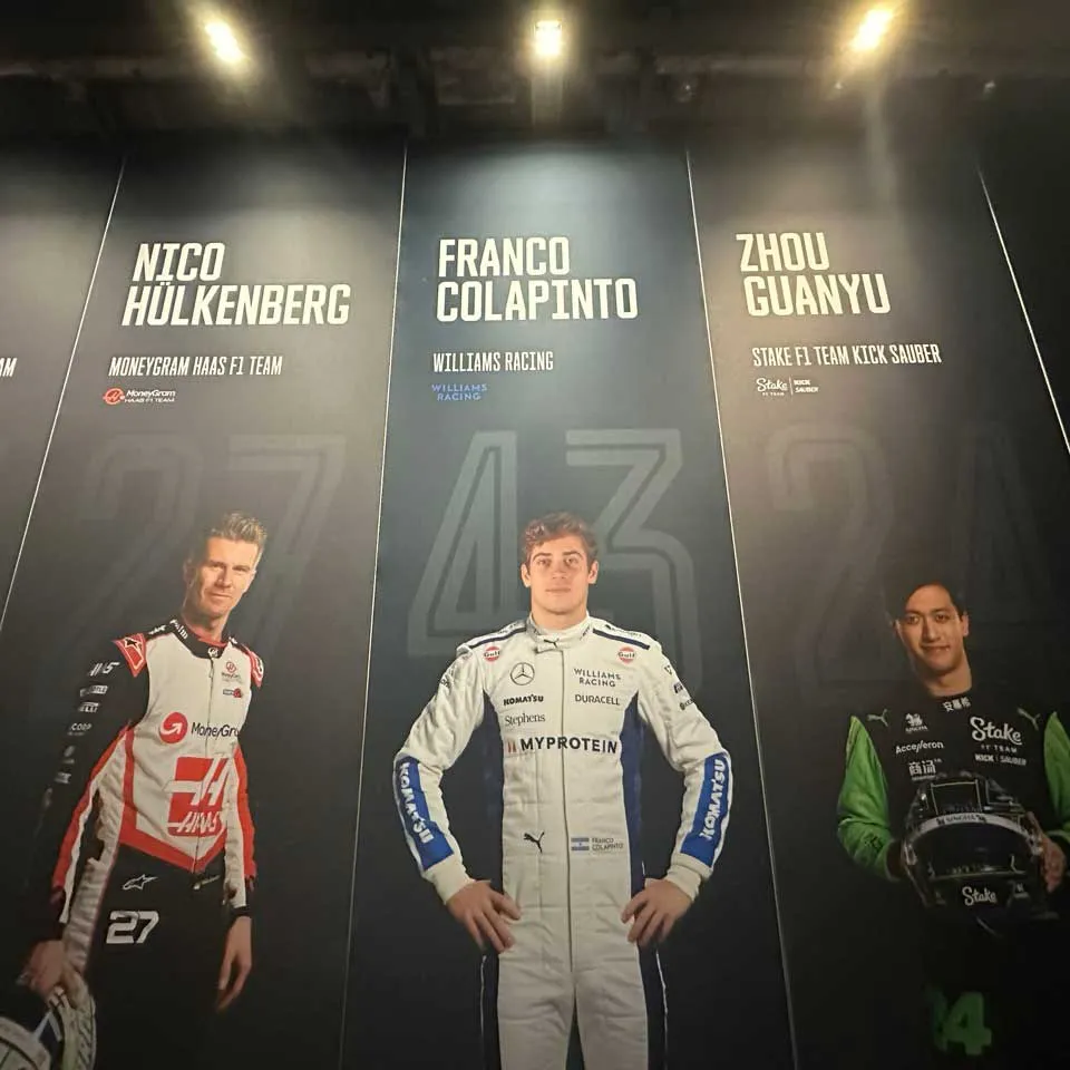 A series of three banners showing the Formula 1 drivers Nico Hülkenberg, Franco Colapinto, and Zhou Guanyu. Colapinto's banner has a notably different background colour than the others, and his pose is relatively unnatural, making it appear like they've photoshopped his head onto a different body.