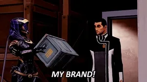 An animated GIF of Commander Shepard from the Mass Effect video games, lifting his arms into the air and shouting 'My brand!'