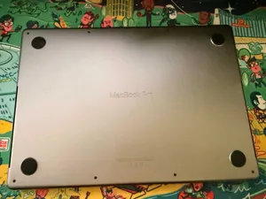 Photograph of Soarin's underside, which is just your bog standard MacBook Pro bottom.