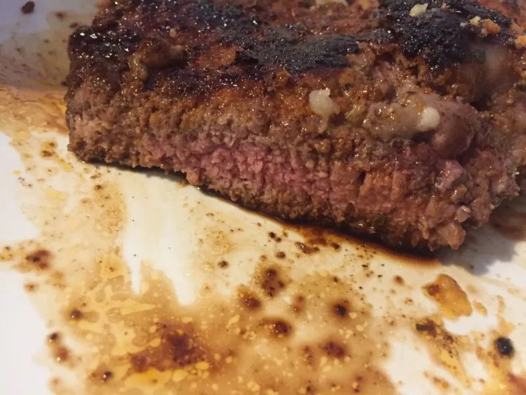 Photo of a steak, cooked medium well.